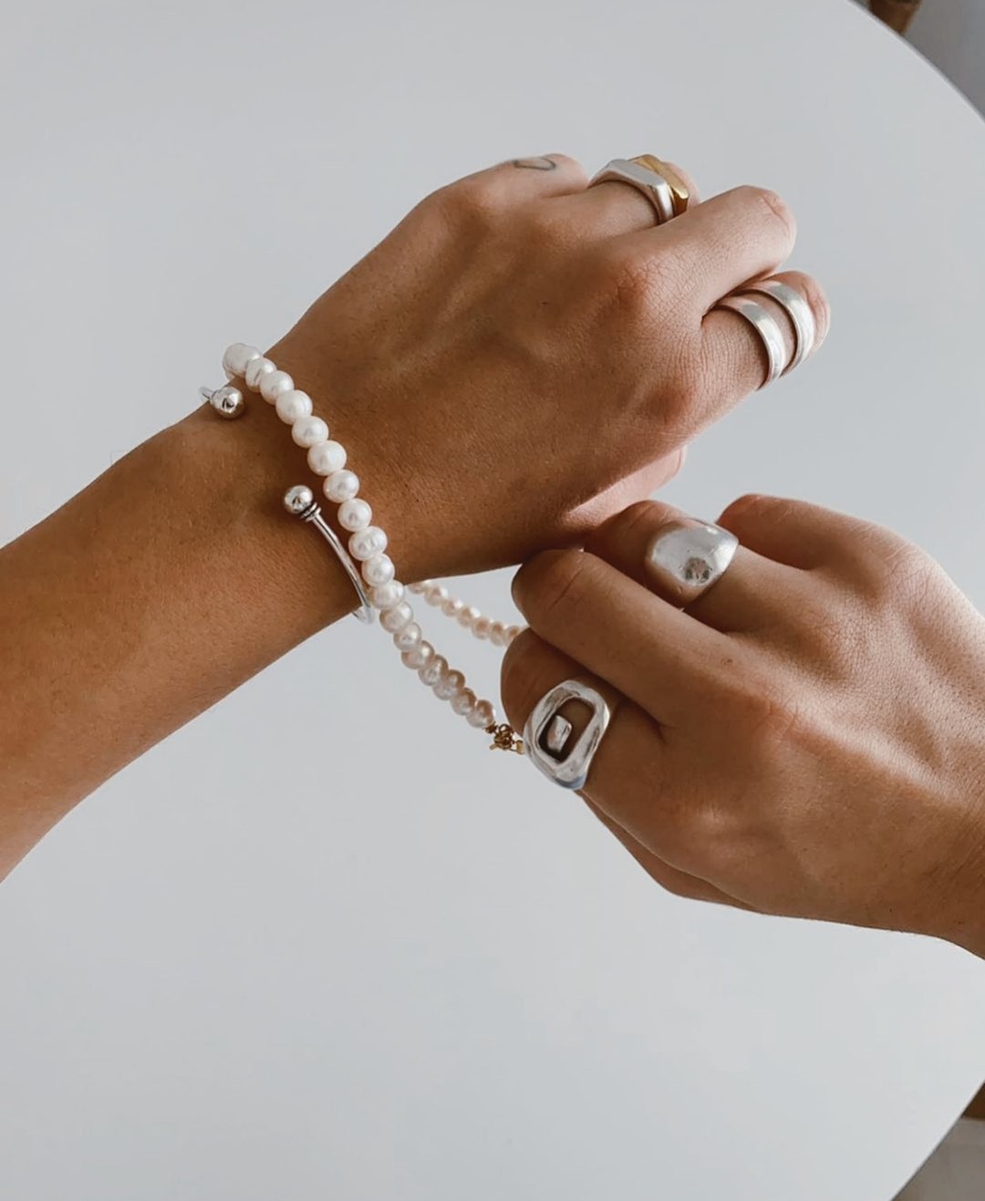 There is no better way to show your "brave and bold" than wearing the right jewelry! State your super woman power with bold, silver rings and embrace the girl inside you with pearls! #Nbrosjewels loves women ❤